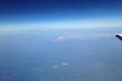 Seattle, WA KBFI to Burbank, CA KBUR - above cloud layer peak of Mount Rainier